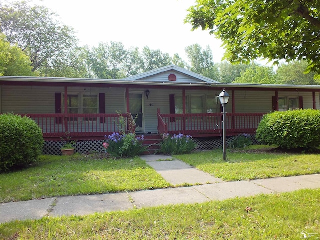 411 Norwood Dr, Monroe, MI 48161 - view of front of home with a porch and a front lawn