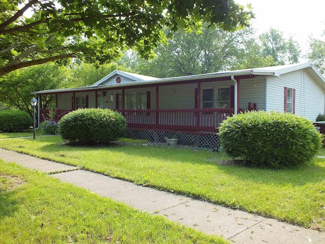 411 Norwood Dr, Monroe, MI 48161 - view of front of property featuring a front yard and a porch