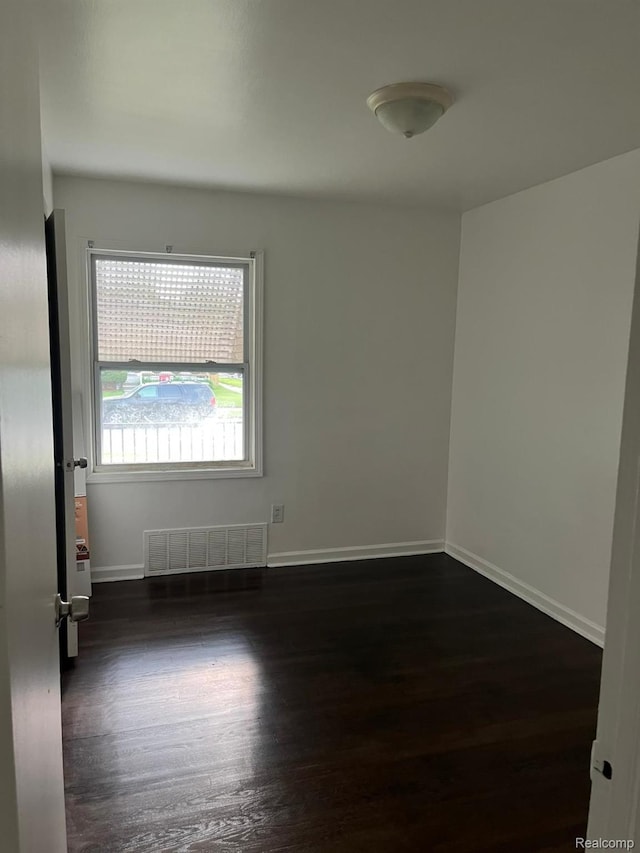 19978 Grandview St, Detroit, MI 48219 - spare room with dark wood-style floors and baseboards