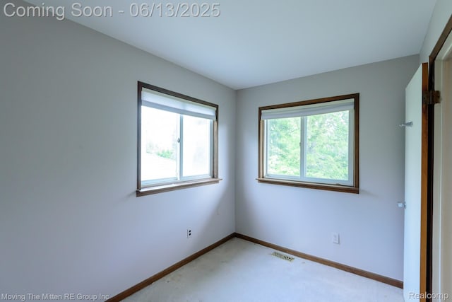 5590 Bayswater Rd, West Bloomfield, MI 48322 - unfurnished room with light carpet and baseboards