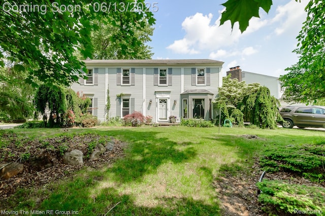 5590 Bayswater Rd, West Bloomfield, MI 48322 - view of front of property with a front lawn