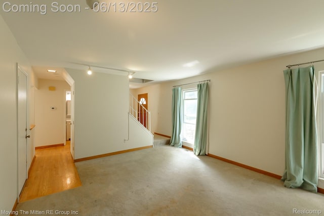5590 Bayswater Rd, West Bloomfield, MI 48322 - unfurnished room with stairway and rail lighting