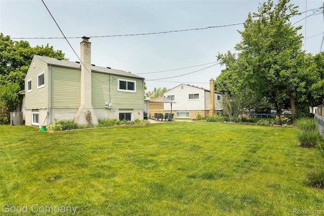 32712 Columbus Dr, Warren, MI 48088 - rear view of house with a chimney