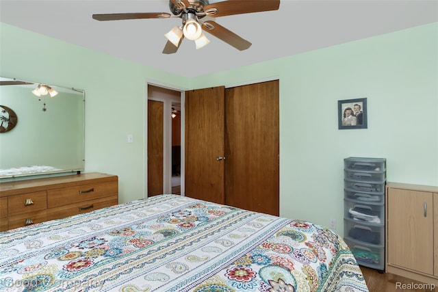 32712 Columbus Dr, Warren, MI 48088 - bedroom with a closet, ceiling fan, and wood finished floors