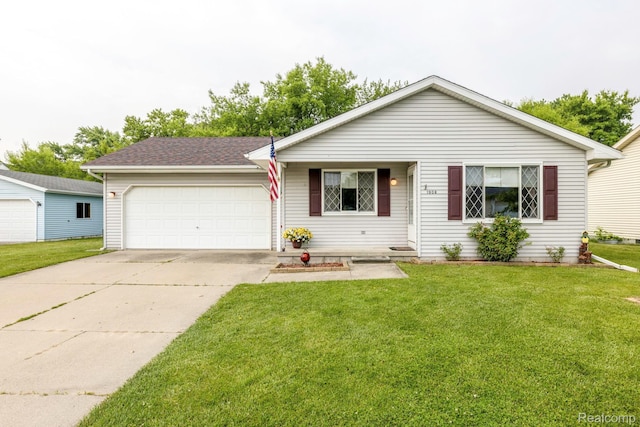 1908 Grant Pl, Port Huron, MI 48060 - view of front facade with a front yard, a garage, and driveway
