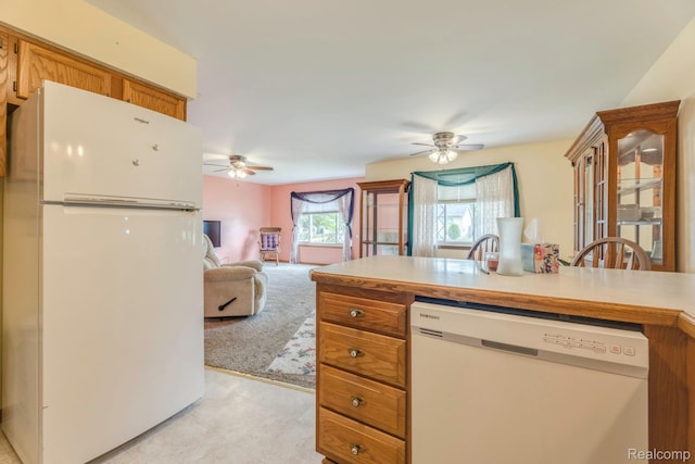 1908 Grant Pl, Port Huron, MI 48060 - kitchen featuring white appliances, a ceiling fan, brown cabinetry, light countertops, and open floor plan