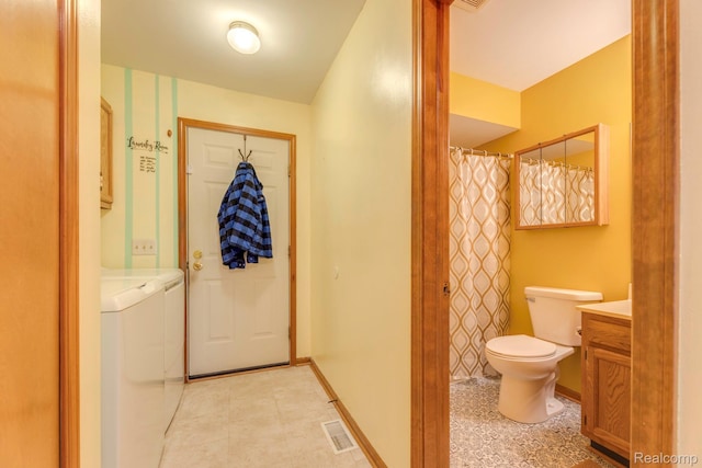 1908 Grant Pl, Port Huron, MI 48060 - full bathroom featuring washing machine and clothes dryer, toilet, vanity, baseboards, and a shower with shower curtain