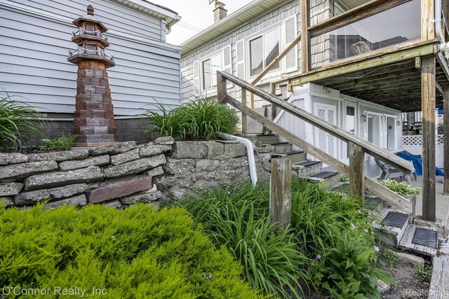 105 Gratiot Blvd, Marysville, MI 48040 - view of side of home with stairs and a wooden deck