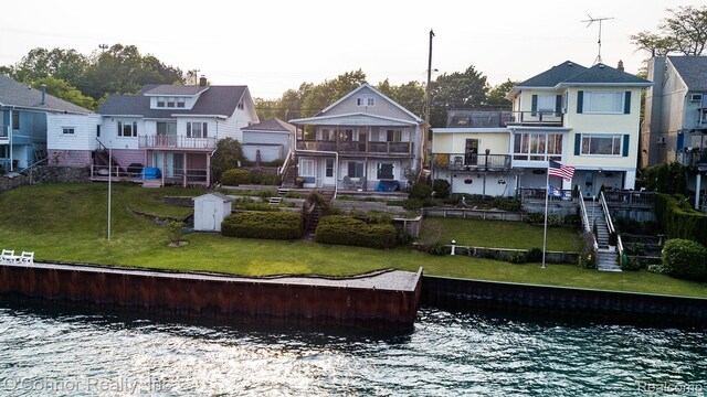 105 Gratiot Blvd, Marysville, MI 48040 - rear view of property with a balcony, a residential view, a water view, and a yard