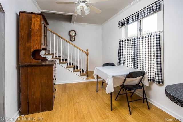 105 Gratiot Blvd, Marysville, MI 48040 - dining room with light wood-type flooring, ornamental molding, baseboards, a ceiling fan, and stairway