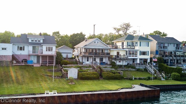 105 Gratiot Blvd, Marysville, MI 48040 - back of house with a lawn, a balcony, a water view, and a residential view