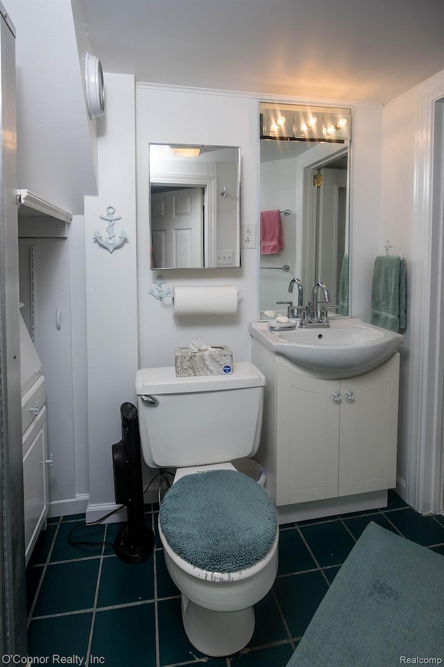 105 Gratiot Blvd, Marysville, MI 48040 - half bathroom with vanity, tile patterned floors, and toilet