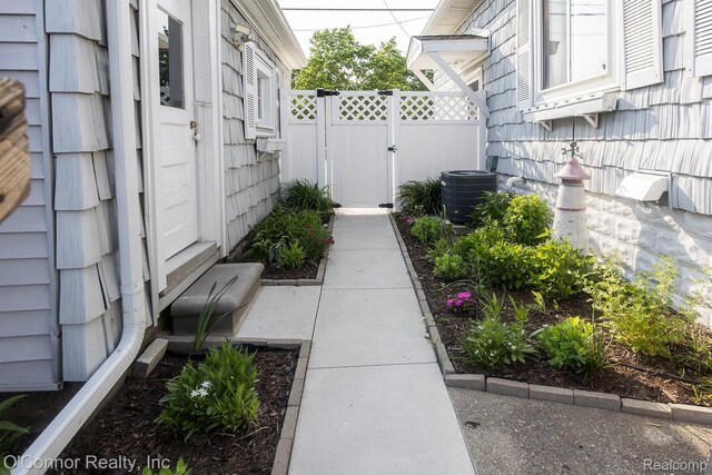 105 Gratiot Blvd, Marysville, MI 48040 - view of yard featuring central AC unit and a gate