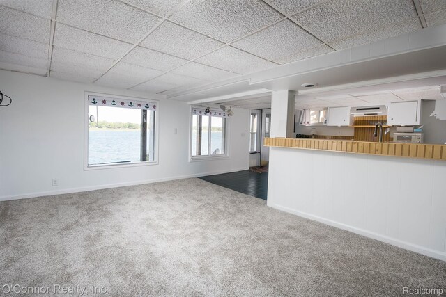 105 Gratiot Blvd, Marysville, MI 48040 - unfurnished living room with carpet, baseboards, and a drop ceiling