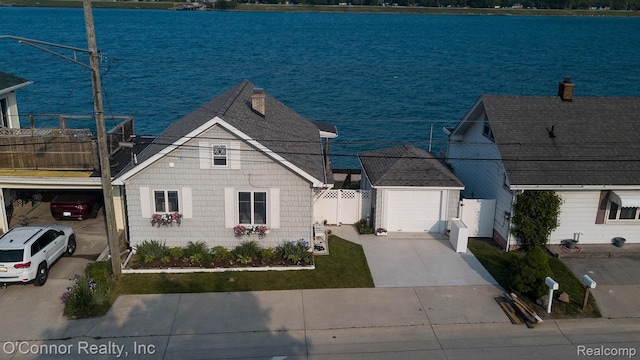 105 Gratiot Blvd, Marysville, MI 48040 - view of front of home with concrete driveway and a water view