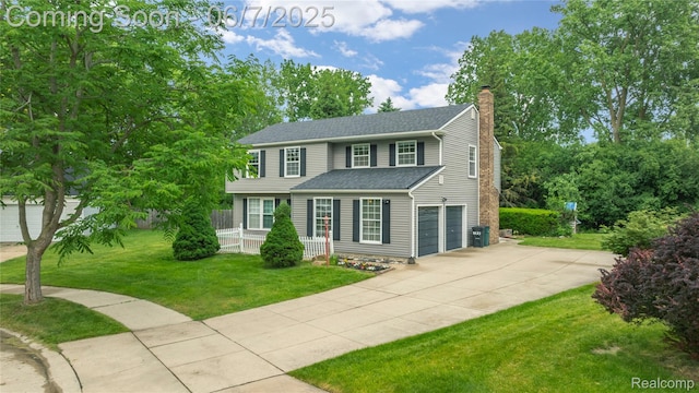 1633 Fleetwood Dr, Troy, MI 48098 - view of front facade with concrete driveway, a chimney, a garage, a front lawn, and a porch