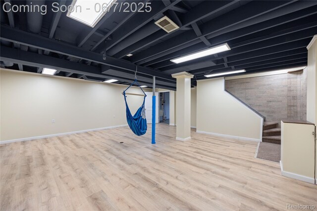 1633 Fleetwood Dr, Troy, MI 48098 - finished basement featuring wood finished floors, baseboards, and stairs