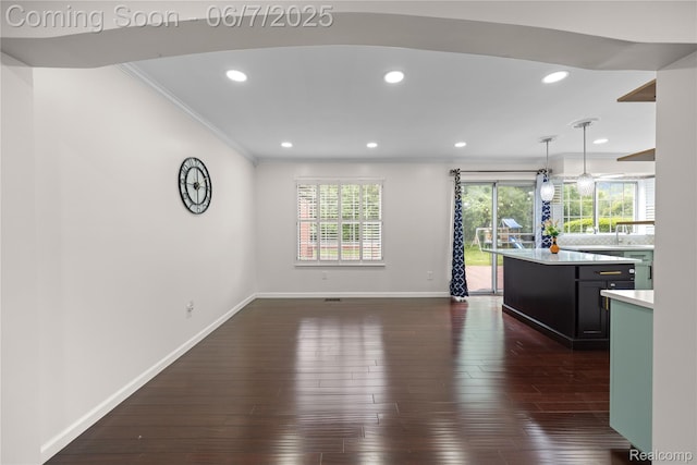 1633 Fleetwood Dr, Troy, MI 48098 - unfurnished living room with crown molding, baseboards, dark wood-style flooring, and recessed lighting