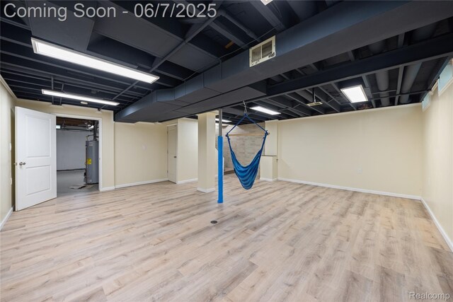 1633 Fleetwood Dr, Troy, MI 48098 - finished basement with water heater, wood finished floors, and baseboards