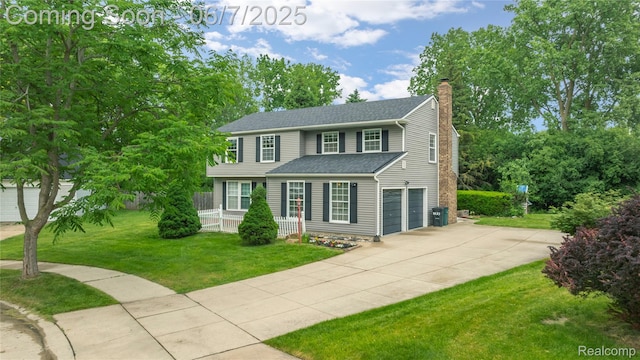 1633 Fleetwood Dr, Troy, MI 48098 - view of front facade with concrete driveway, a chimney, an attached garage, a front yard, and a porch