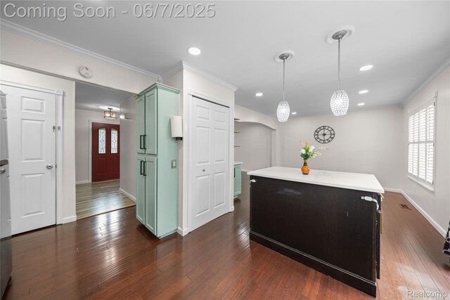 1633 Fleetwood Dr, Troy, MI 48098 - kitchen featuring green cabinets, ornamental molding, baseboards, recessed lighting, and a kitchen island