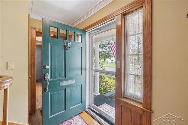 2505 Court St, Saginaw, MI 48602 - entrance foyer featuring crown molding and light wood-style floors