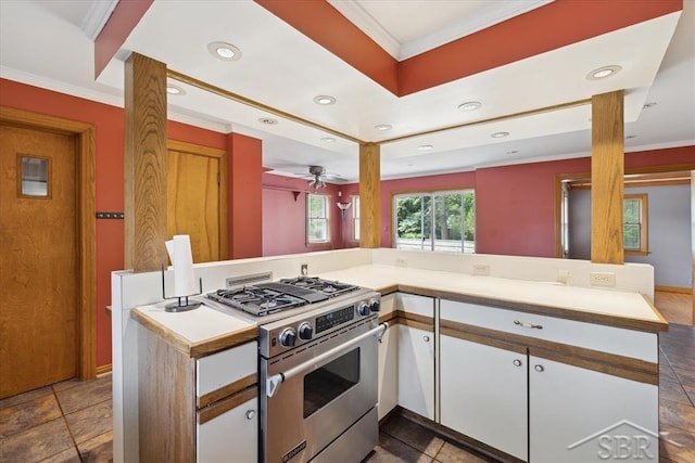 2505 Court St, Saginaw, MI 48602 - kitchen featuring stainless steel range, crown molding, white cabinetry, light countertops, and recessed lighting
