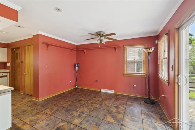 2505 Court St, Saginaw, MI 48602 - empty room featuring ceiling fan, baseboards, ornamental molding, and stone finish flooring