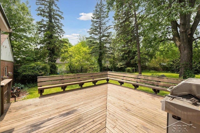 2505 Court St, Saginaw, MI 48602 - wooden deck featuring view of scattered trees