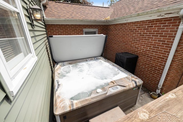 2505 Court St, Saginaw, MI 48602 - view of patio / terrace featuring a hot tub and a balcony