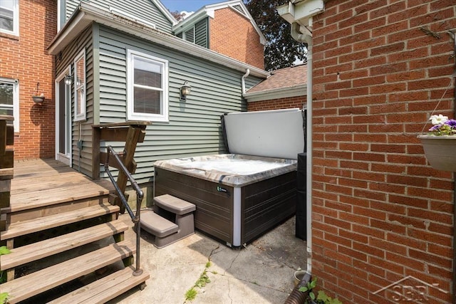 2505 Court St, Saginaw, MI 48602 - wooden terrace featuring a hot tub and a patio area