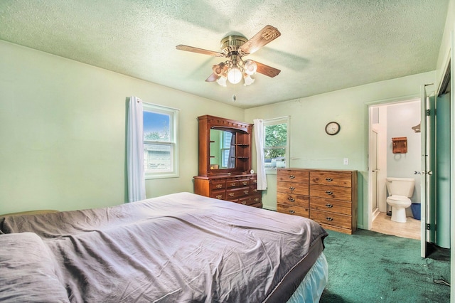 202 Maple St, Three Oaks, MI 49128 - carpeted bedroom featuring a textured ceiling, ceiling fan, and ensuite bathroom