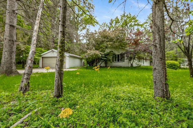 12270 Linden Ave, Sawyer, MI 49125 - view of front of house featuring an outdoor structure and a front lawn