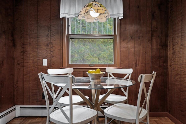 12270 Linden Ave, Sawyer, MI 49125 - dining space featuring wooden walls and a baseboard radiator