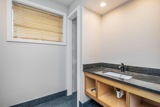 7362 30th St SE, Ada, MI 49301 - bathroom featuring a sink and tile patterned flooring