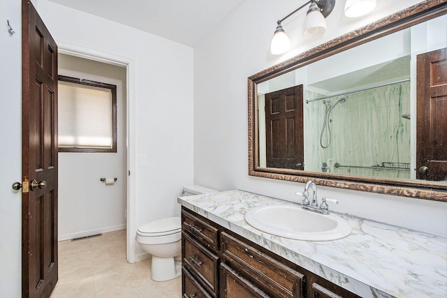 7362 30th St SE, Ada, MI 49301 - full bath featuring vanity, an enclosed shower, toilet, baseboards, and tile patterned flooring