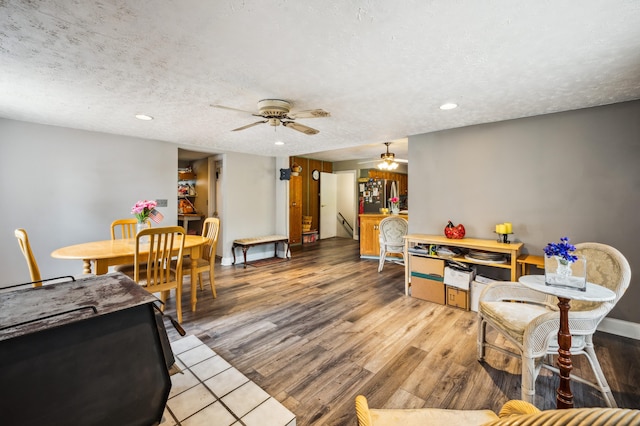 50902 Magician Lk Rd, Dowagiac, MI 49047 - dining space featuring ceiling fan, light wood-type flooring, a textured ceiling, recessed lighting, and baseboards