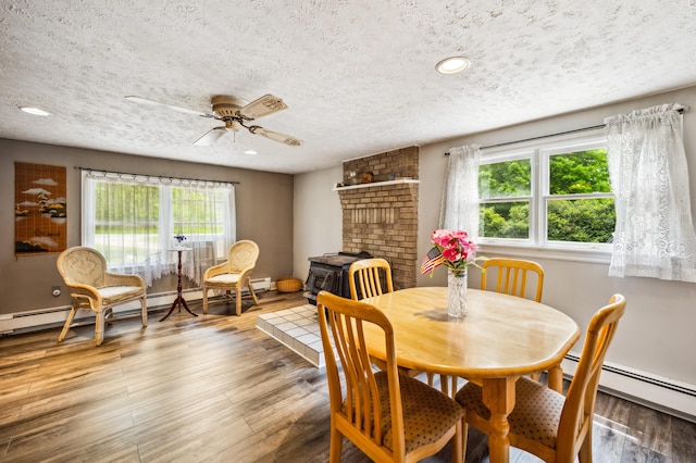 50902 Magician Lk Rd, Dowagiac, MI 49047 - dining space with a textured ceiling, plenty of natural light, a ceiling fan, wood finished floors, and recessed lighting