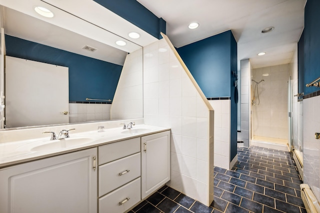 50902 Magician Lk Rd, Dowagiac, MI 49047 - full bathroom featuring tile walls, tile patterned flooring, a stall shower, double vanity, and recessed lighting
