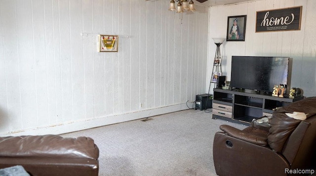 4107 Windward Dr, Lansing, MI 48911 - carpeted living area with a ceiling fan and wooden walls