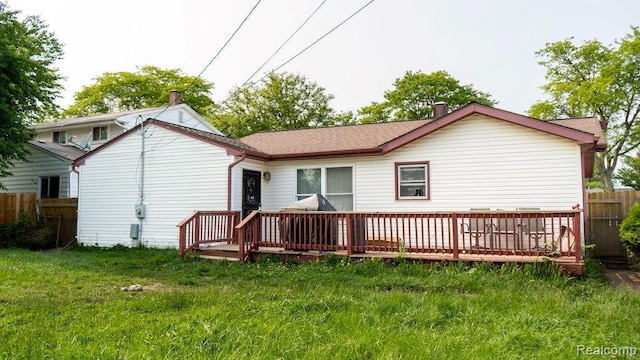 4107 Windward Dr, Lansing, MI 48911 - rear view of property featuring a wooden deck and a shingled roof