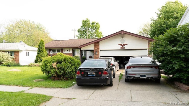 4107 Windward Dr, Lansing, MI 48911 - view of front of house featuring driveway, an attached garage, and a front lawn