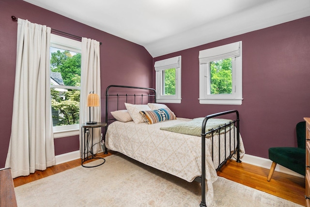 1512 Shadford Rd, Ann Arbor, MI 48104 - bedroom featuring multiple windows, wood finished floors, and baseboards