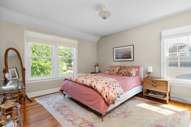 1512 Shadford Rd, Ann Arbor, MI 48104 - bedroom featuring wood finished floors, baseboards, and lofted ceiling
