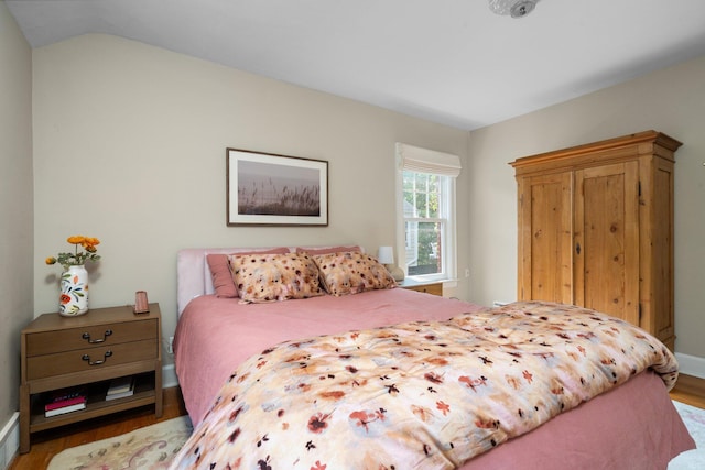 1512 Shadford Rd, Ann Arbor, MI 48104 - bedroom featuring wood finished floors, baseboards, and vaulted ceiling