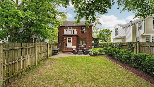 1512 Shadford Rd, Ann Arbor, MI 48104 - back of property with brick siding, a patio area, and a balcony