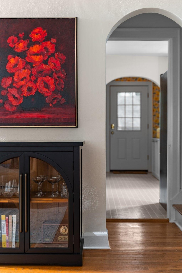 1512 Shadford Rd, Ann Arbor, MI 48104 - entrance foyer with arched walkways, wood finished floors, and baseboards