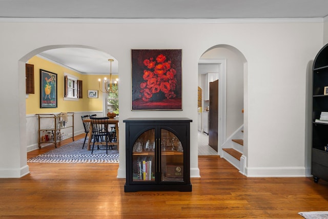 1512 Shadford Rd, Ann Arbor, MI 48104 - living area featuring ornamental molding, hardwood / wood-style floors, baseboards, and a chandelier