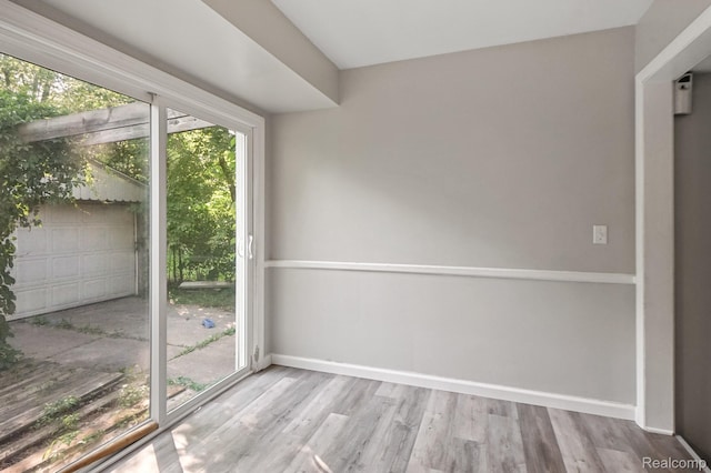 1621 Greenbrook Ln, Flint, MI 48507 - doorway to outside with wood finished floors and baseboards