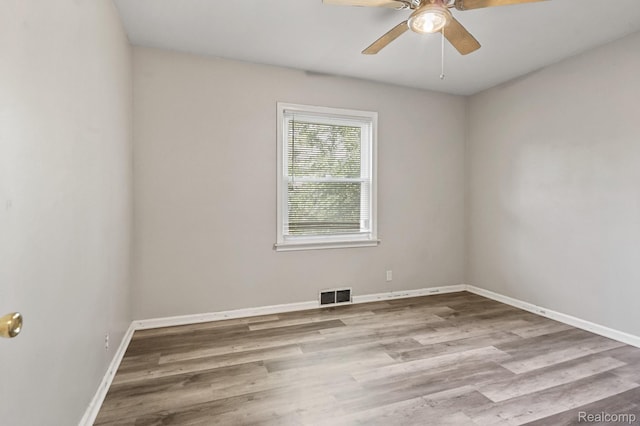 1621 Greenbrook Ln, Flint, MI 48507 - unfurnished room with a ceiling fan and wood finished floors